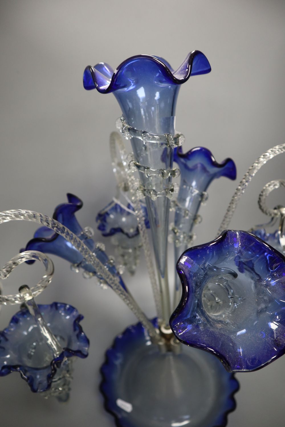 A Victorian blue and clear glass epergne, with trailed glass ornament, 49cm